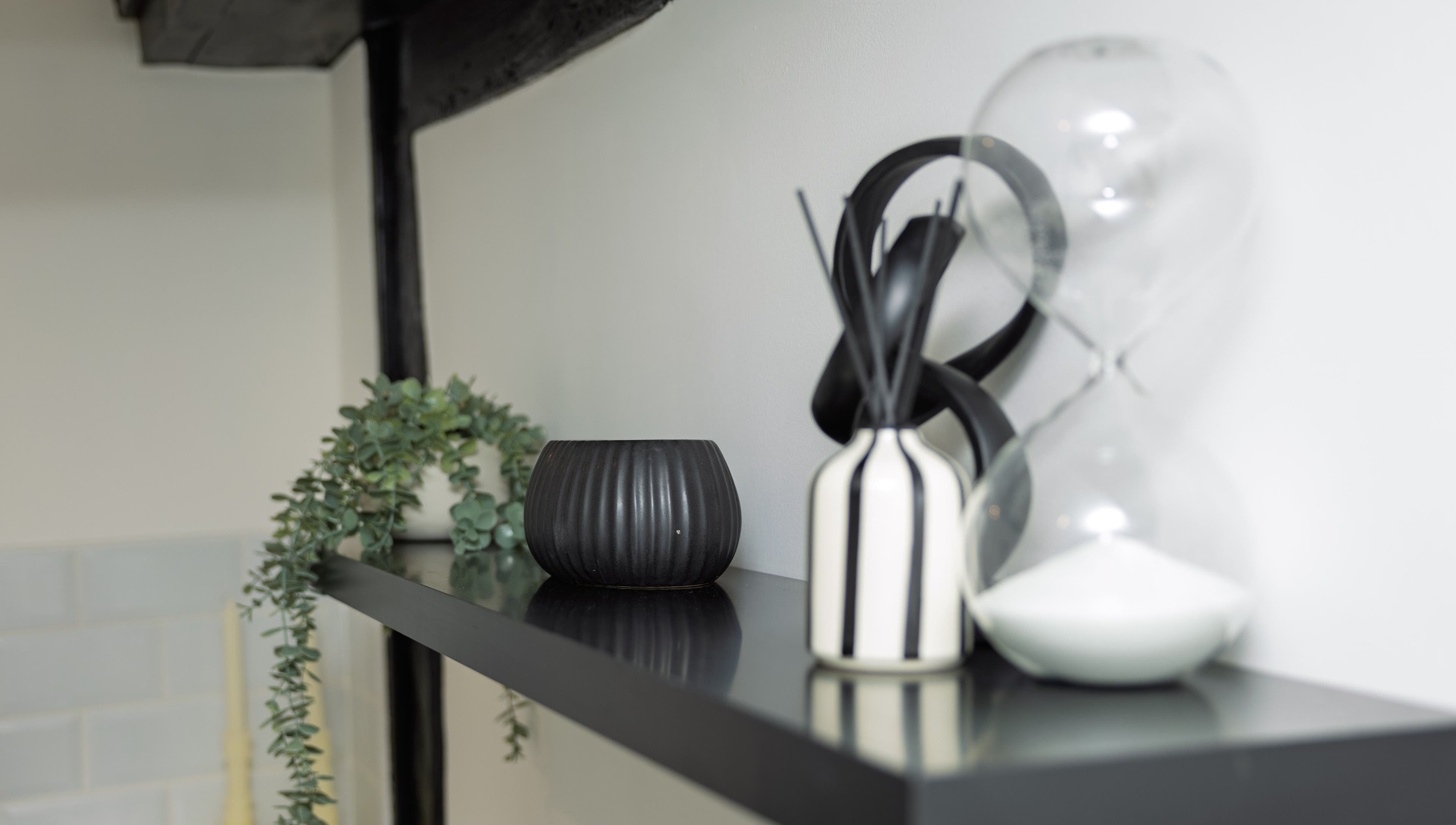 Elegant decorative items on a black shelf at The Sigma Clinic, Chelmsford, England, GB.