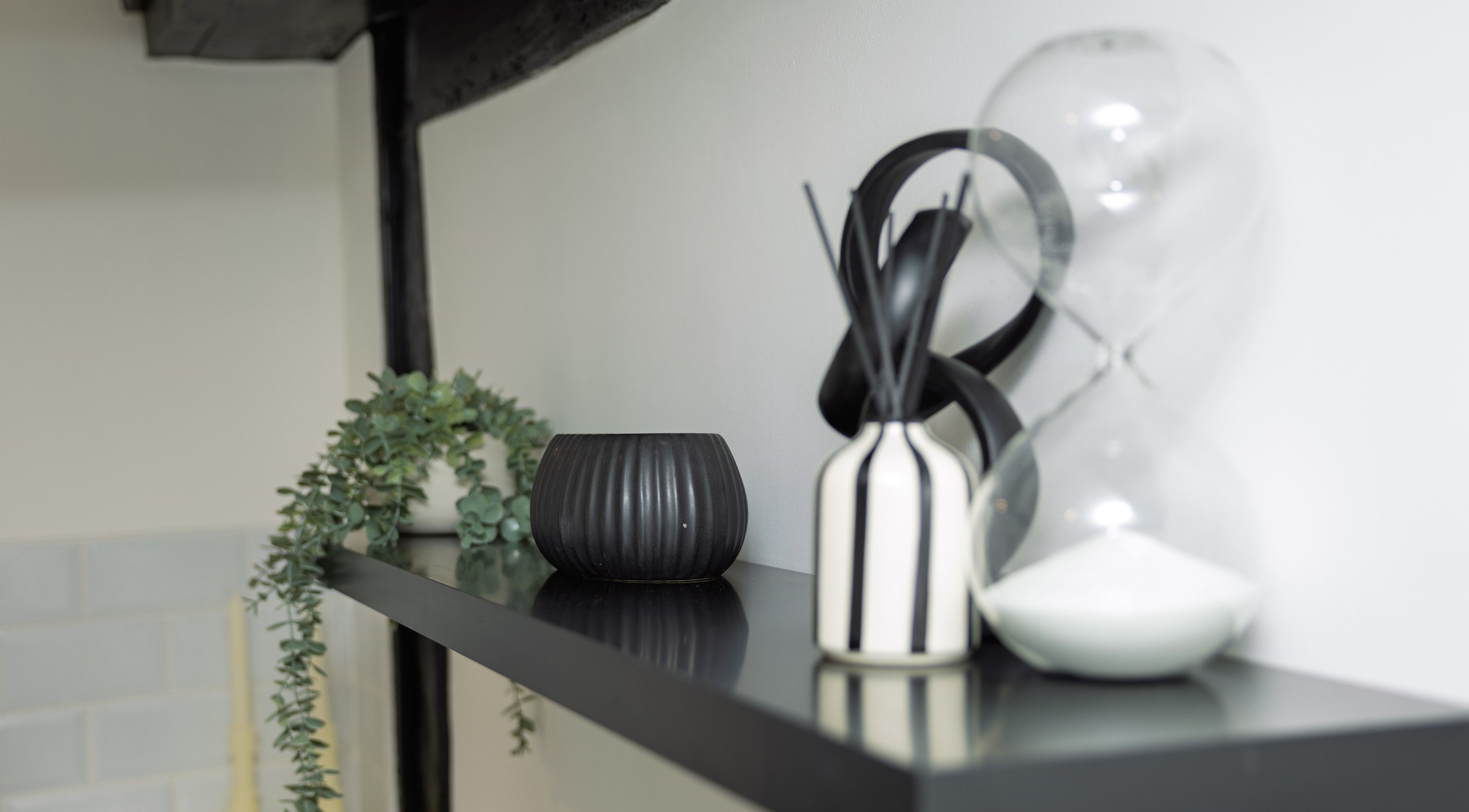 Elegant decorative items on a black shelf at The Sigma Clinic, Chelmsford, England, GB.