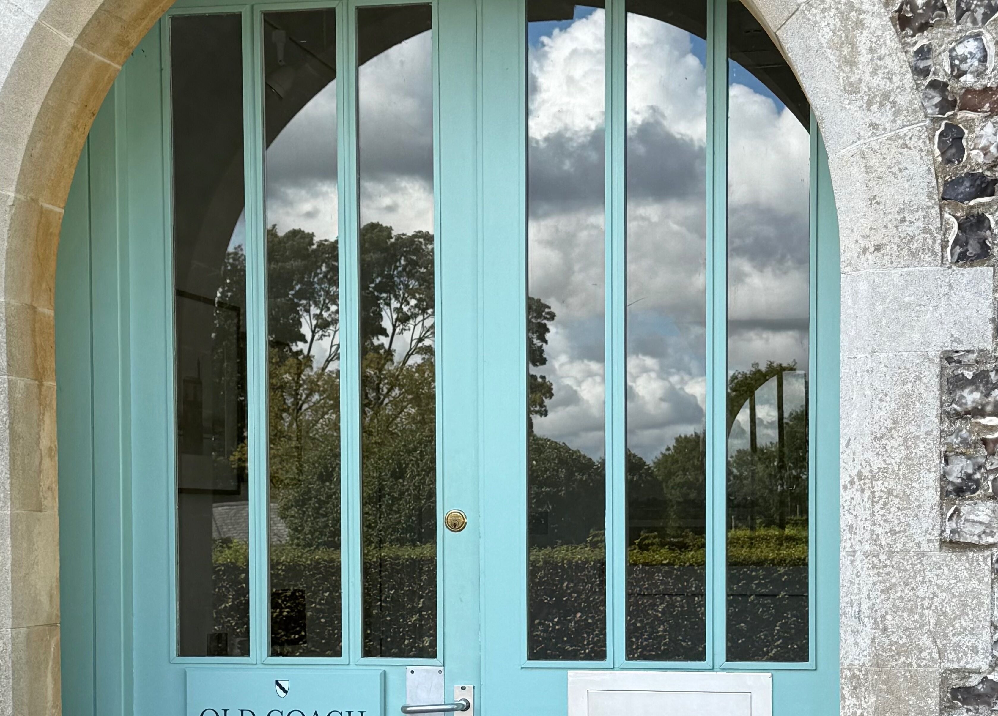 Chloë Jane Aesthetics' elegant blue door at Farleigh Wallop, England, GB blends rustic charm and modern design.