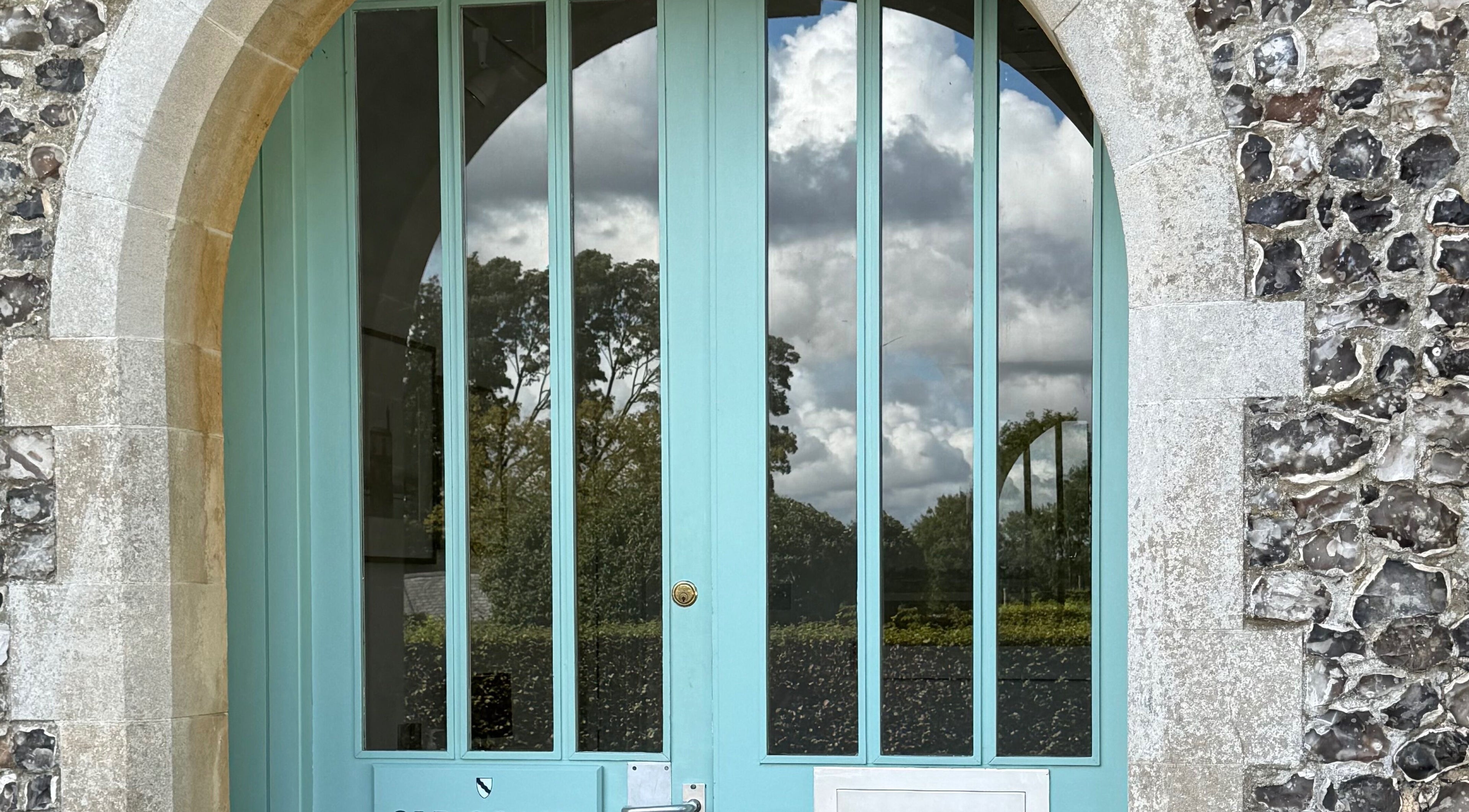 Chloë Jane Aesthetics' elegant blue door at Farleigh Wallop, England, GB blends rustic charm and modern design.