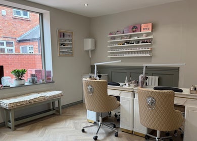 Elegant nail station at Ann's Nails and Beauty, Ruddington, England, GB, with plush seating and modern decor.