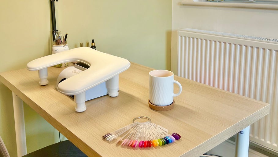 Modern nail station at The Harrogate Nail Artist in Harrogate, England, GB, with UV lamp and color palette.