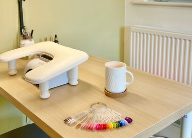 Cozy nail station at The Harrogate Nail Artist in Harrogate, England, GB, showcasing vibrant polish options.
