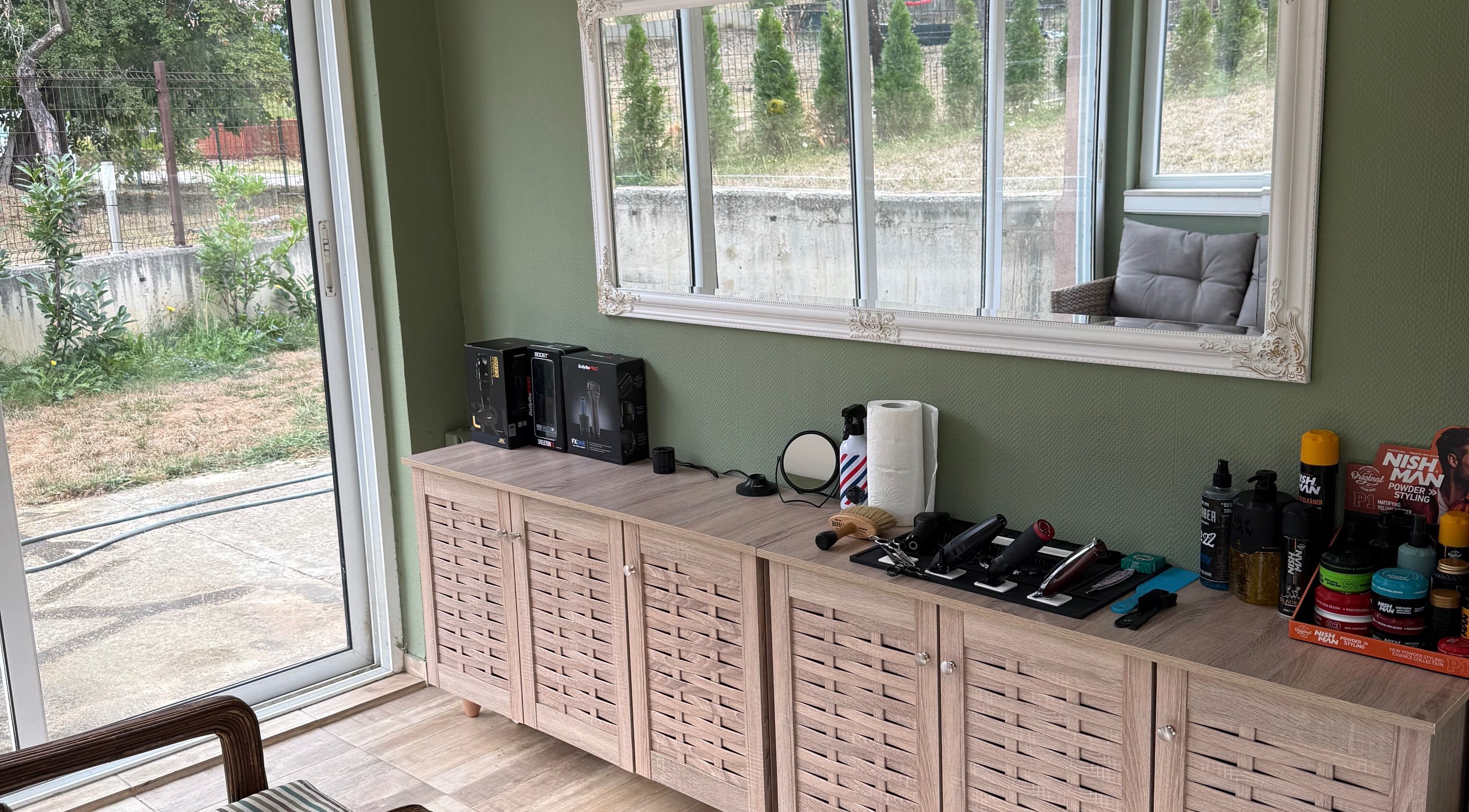 IndCuts21's bright salon station in Pravets, Sofiyska Oblast, BG showcasing hair tools and elegant decor.