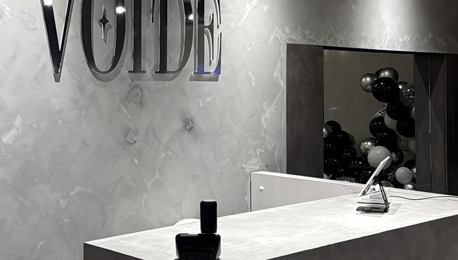 Elegant reception area of VOIDE nail studio in Richmond, British Columbia, CA with modern decor.