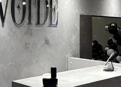 Elegant reception area of VOIDE nail studio in Richmond, British Columbia, CA with modern decor.