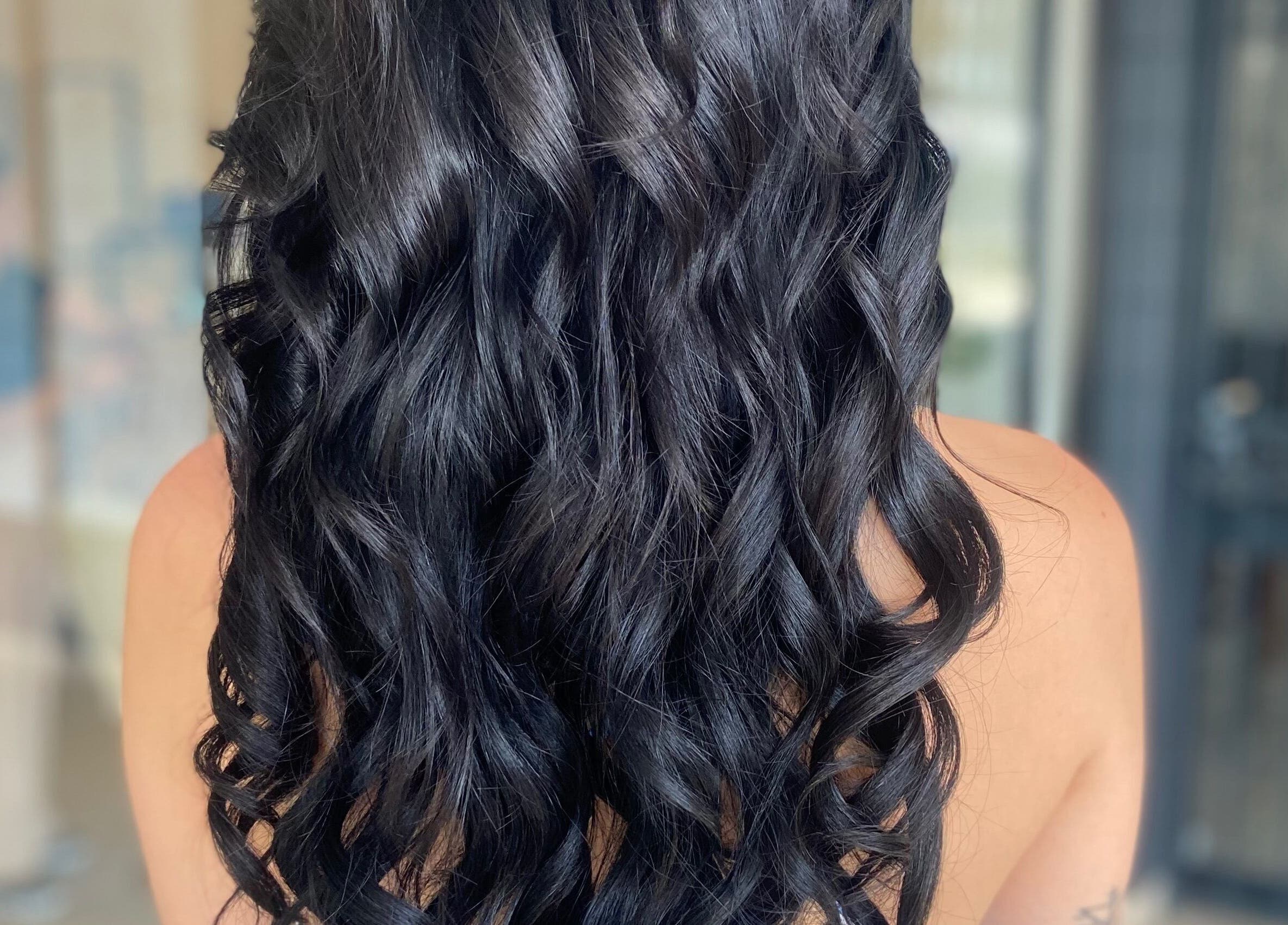 Voluminous curly hair extension styled at Nobs Hair Extensions Studio, Johannesburg, Gauteng, ZA.