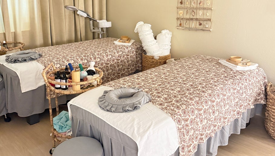 Cozy massage tables at Moonme Spa, Newport Beach, California, US, set for relaxation and pampering.