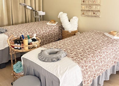 Cozy massage tables at Moonme Spa, Newport Beach, California, US, set for relaxation and pampering.