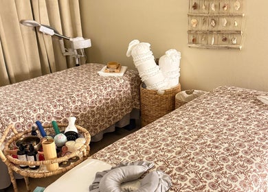 Tranquil therapy room at Moonme Spa, Newport Beach, California, US with twin treatment beds.