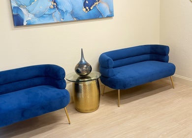 Blue velvet seating at Moonme Spa, Newport Beach, California, US, enhancing relaxation and style.