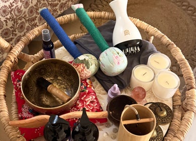 Relaxing spa essentials at Moonme Spa in Newport Beach, California, US showcasing candles and massage tools.