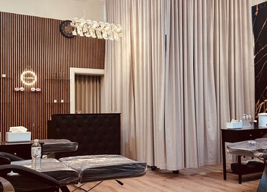 Chic interior of Brow & Lash Queen in Melbourne, Victoria, AU, featuring plush treatment chairs and elegant decor.