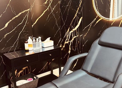 Luxurious treatment room at Brow & Lash Queen, Melbourne, Victoria, AU with chic decor and reclining chair.