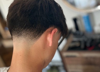 Close-up of a stylish fade haircut at CutByOC in Saltdean, England, GB.