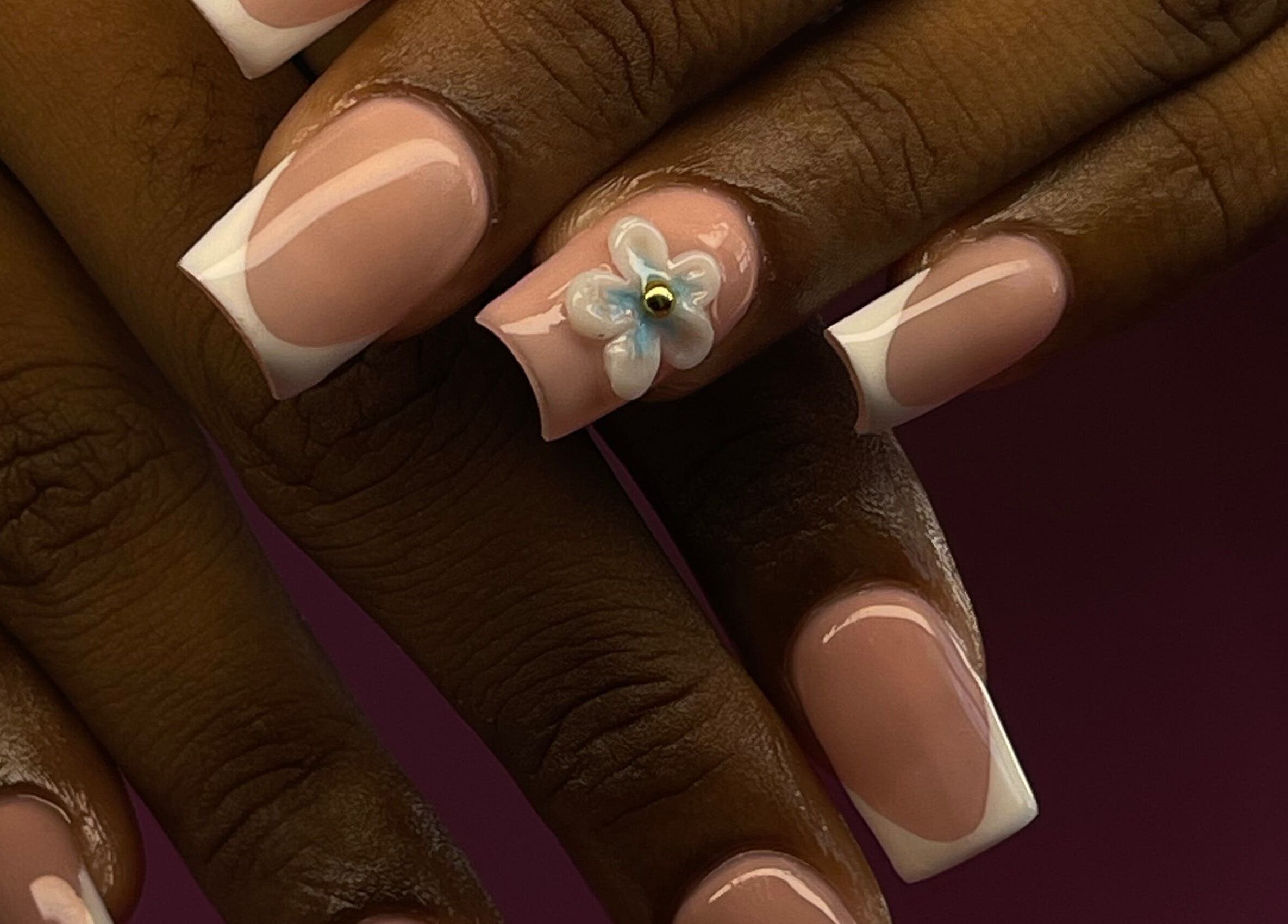 Elegant Tips in Ocho Rios, JM showcases a floral nail design with glossy finish.
