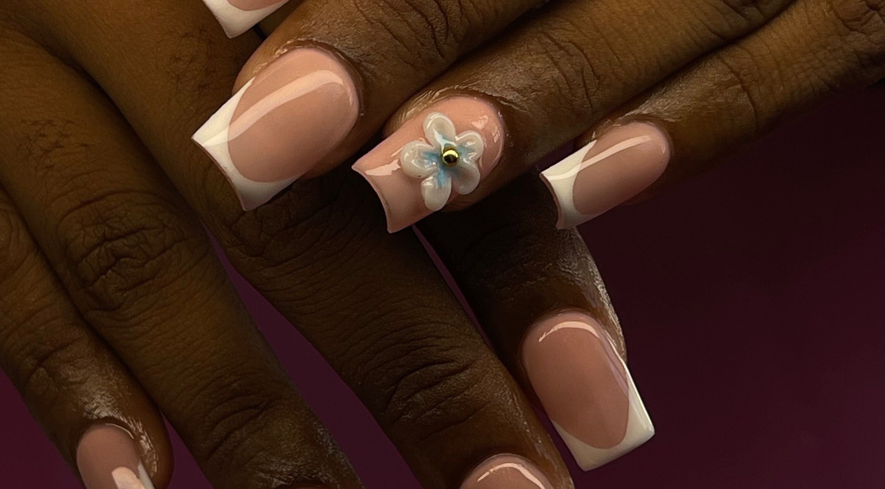Elegant Tips in Ocho Rios, JM showcases a floral nail design with glossy finish.
