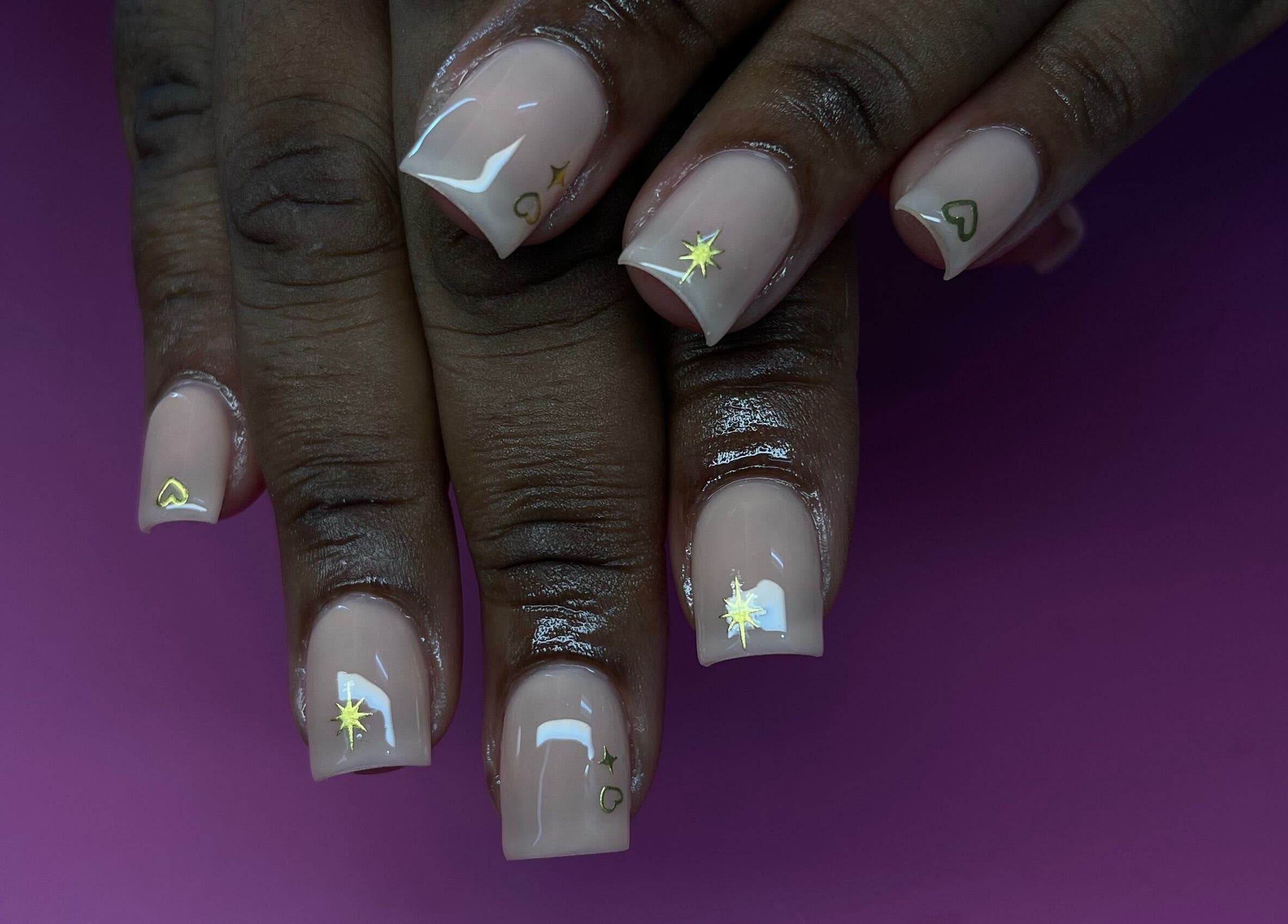 Elegant tips showcases classy nail art in Ocho Rios, JM with glossy gel finish and star accents.