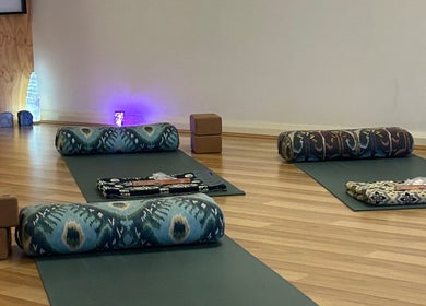 Peaceful yoga setup at Butterfly Energy in Duncraig, Western Australia, AU with mats, bolsters, and soft lighting.
