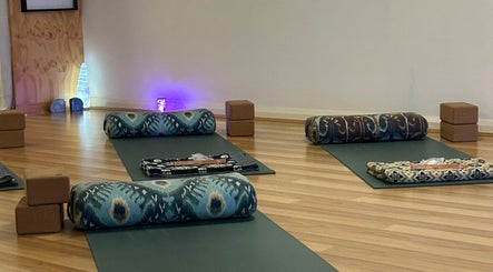 Peaceful yoga setup at Butterfly Energy in Duncraig, Western Australia, AU with mats, bolsters, and soft lighting.