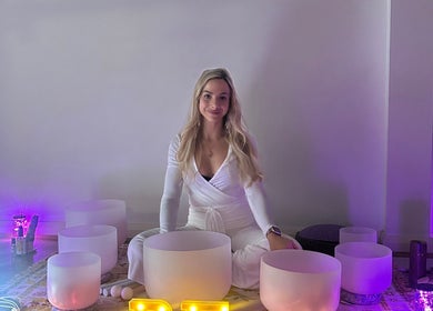 A serene woman with crystal bowls at Butterfly Energy, Duncraig, Western Australia, AU.