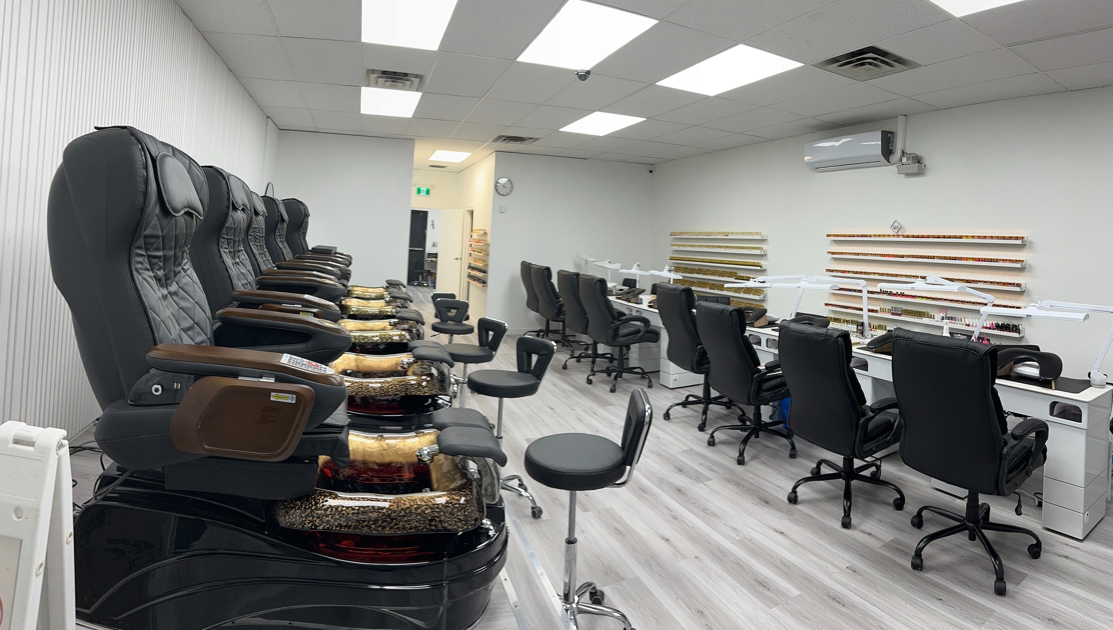 Luxurious spa chairs and nail stations at Elite Nails, Lower Sackville, Nova Scotia, CA, highlighting comfort and style.