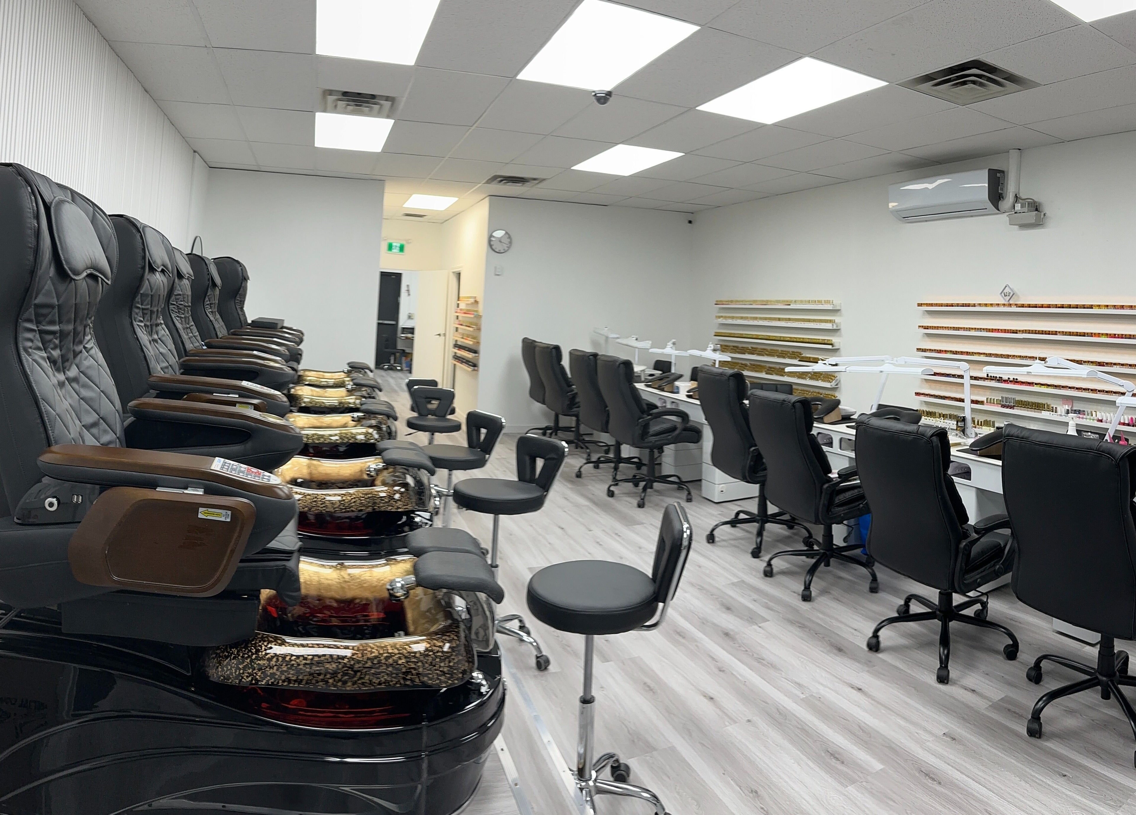 Luxurious spa chairs and nail stations at Elite Nails, Lower Sackville, Nova Scotia, CA, highlighting comfort and style.