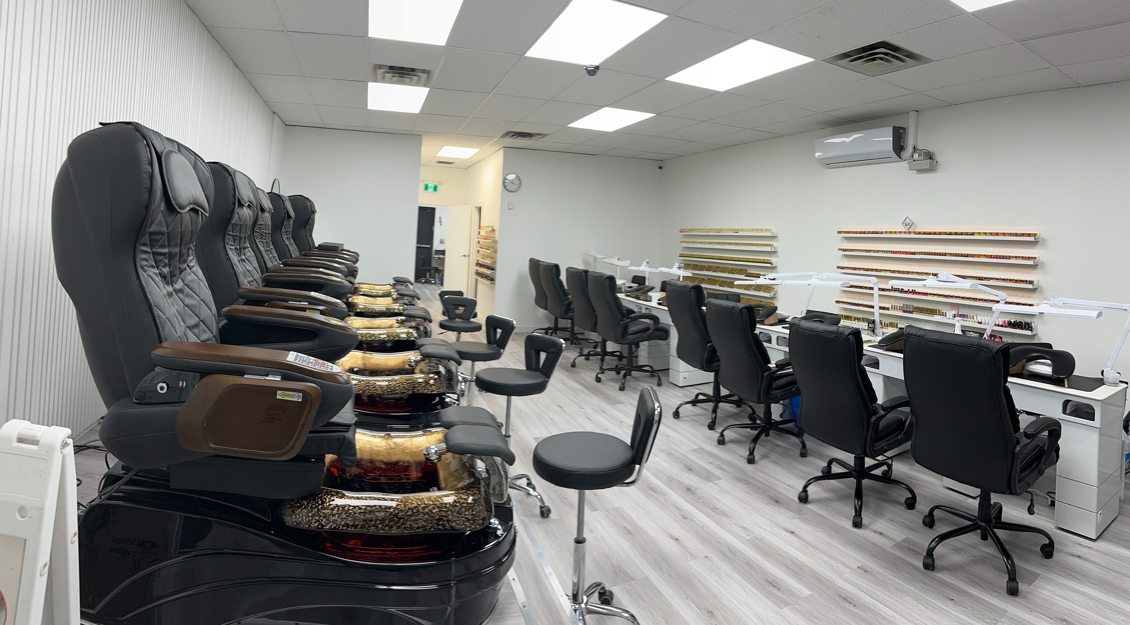 Luxurious spa chairs and nail stations at Elite Nails, Lower Sackville, Nova Scotia, CA, highlighting comfort and style.
