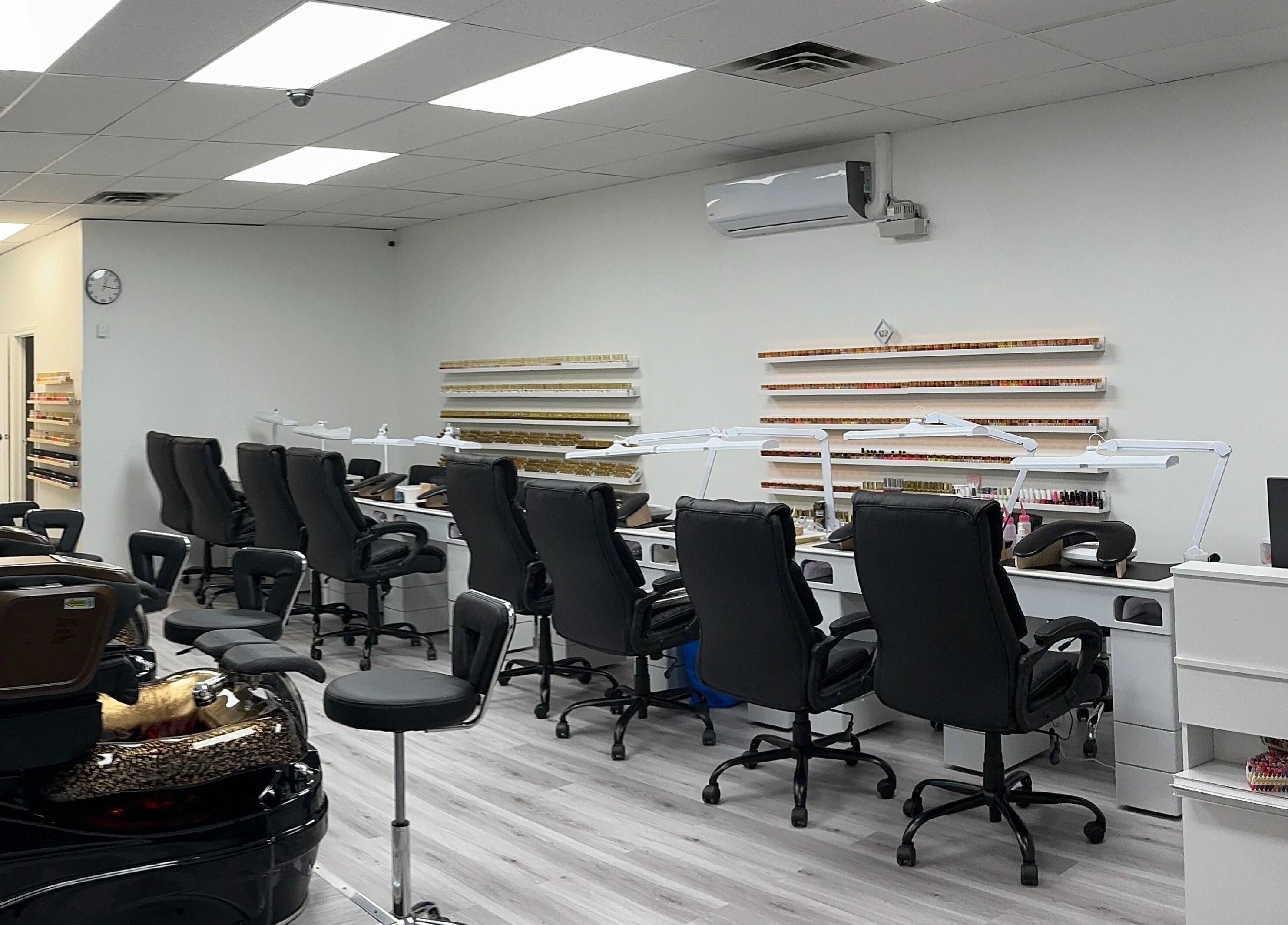 Modern interior of Elite Nails in Lower Sackville, Nova Scotia, CA with stylish manicure stations.