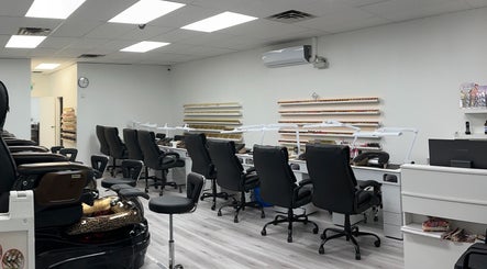 Modern interior of Elite Nails in Lower Sackville, Nova Scotia, CA with stylish manicure stations.