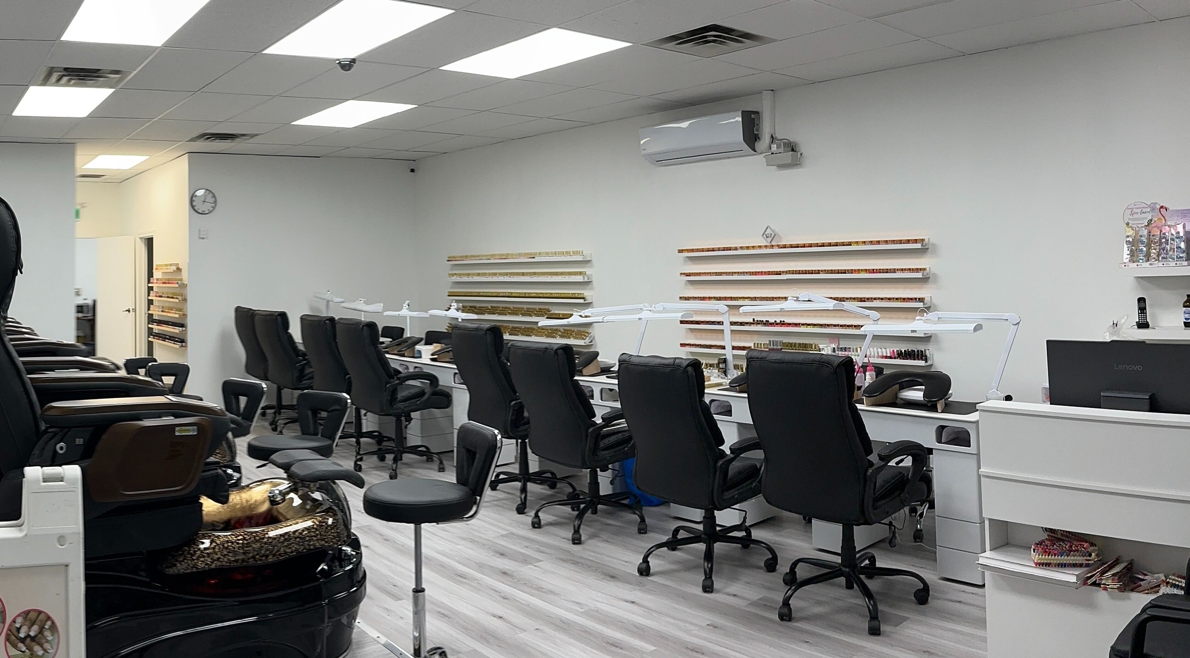 Modern interior of Elite Nails in Lower Sackville, Nova Scotia, CA with stylish manicure stations.