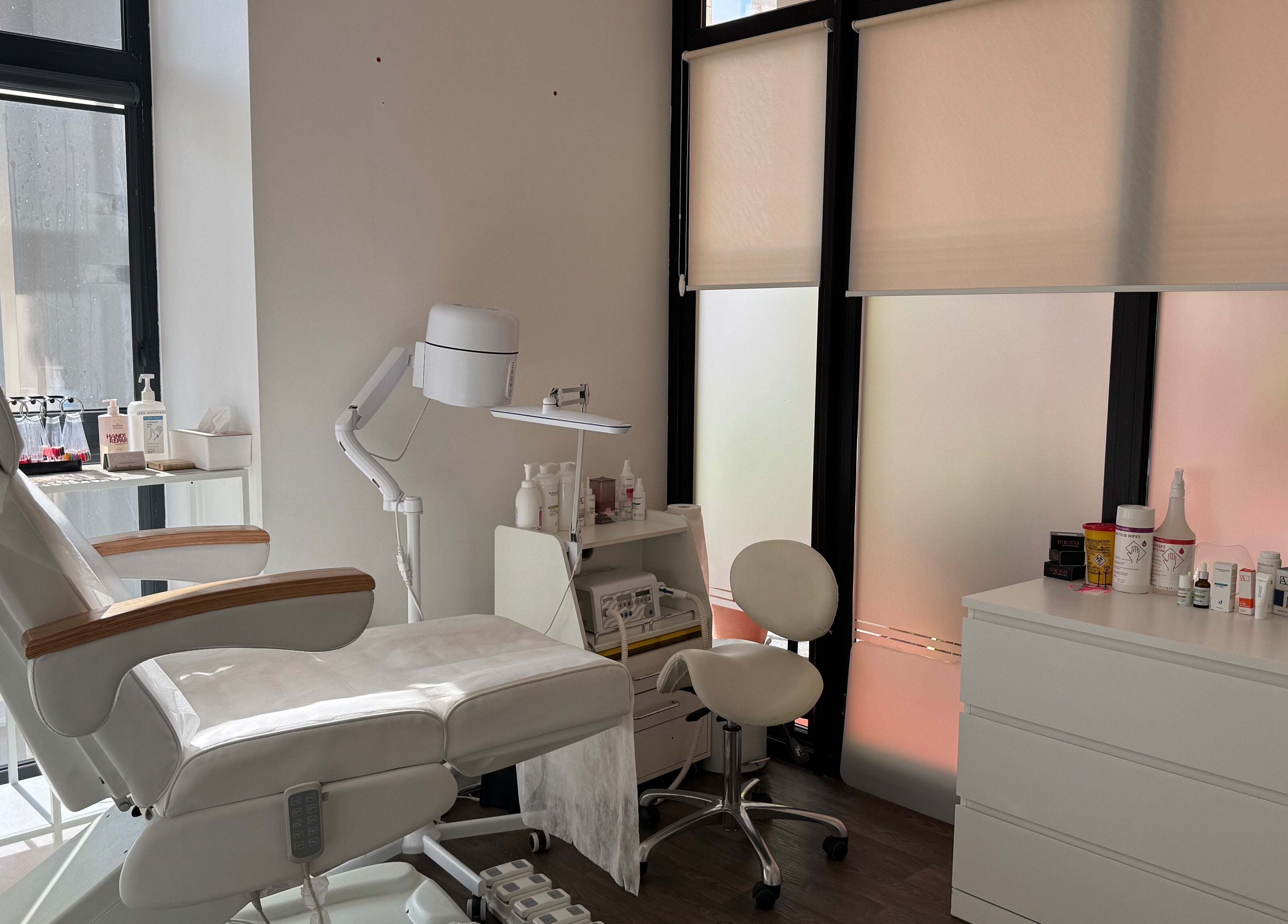 Modern podology room at Jelgavas Podologs in Jelgava, LV, featuring a comfortable chair and wellness products.