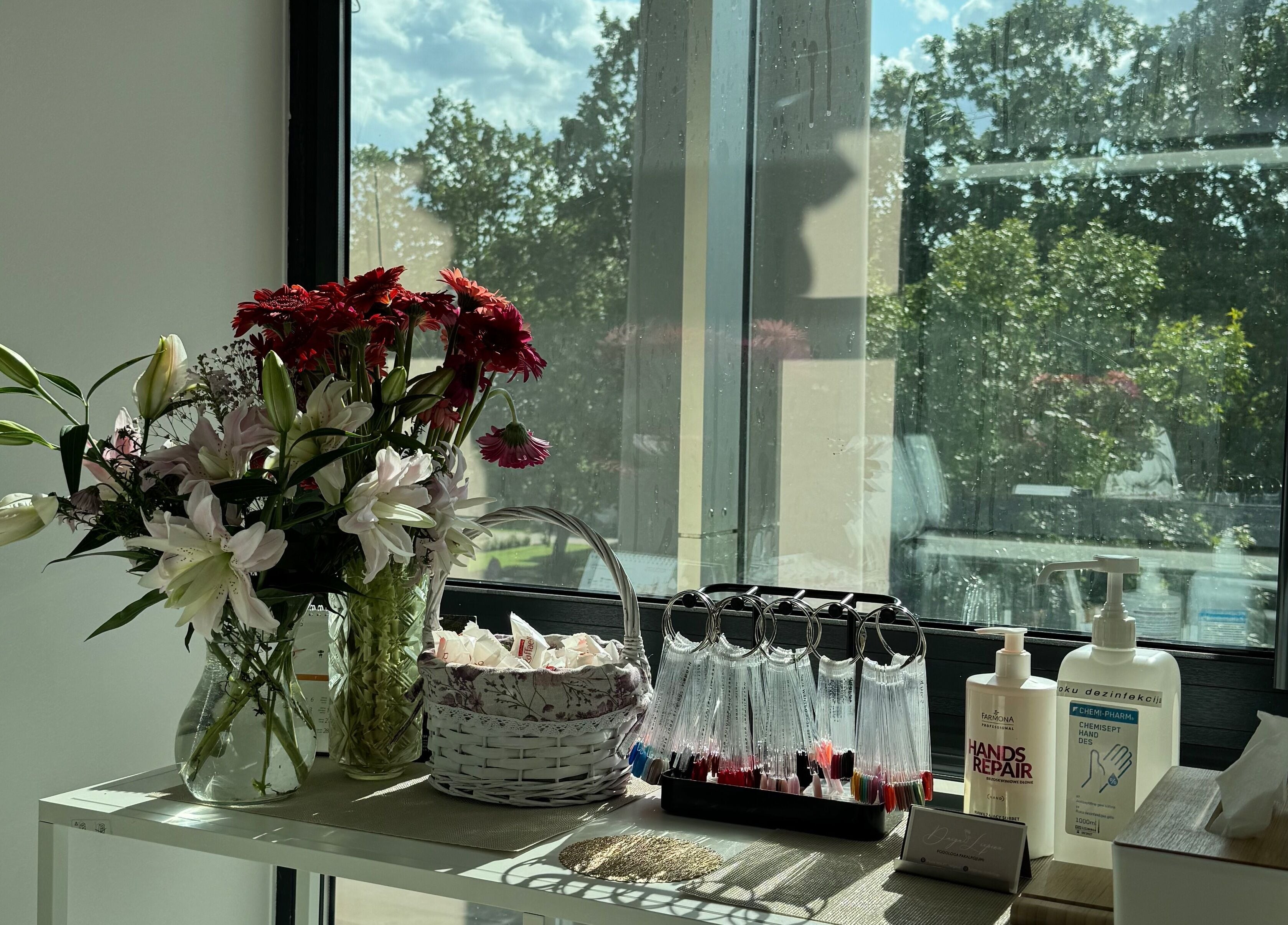 Bright flowers and beauty products by the window at Jelgavas Podologs, Jelgava, LV.