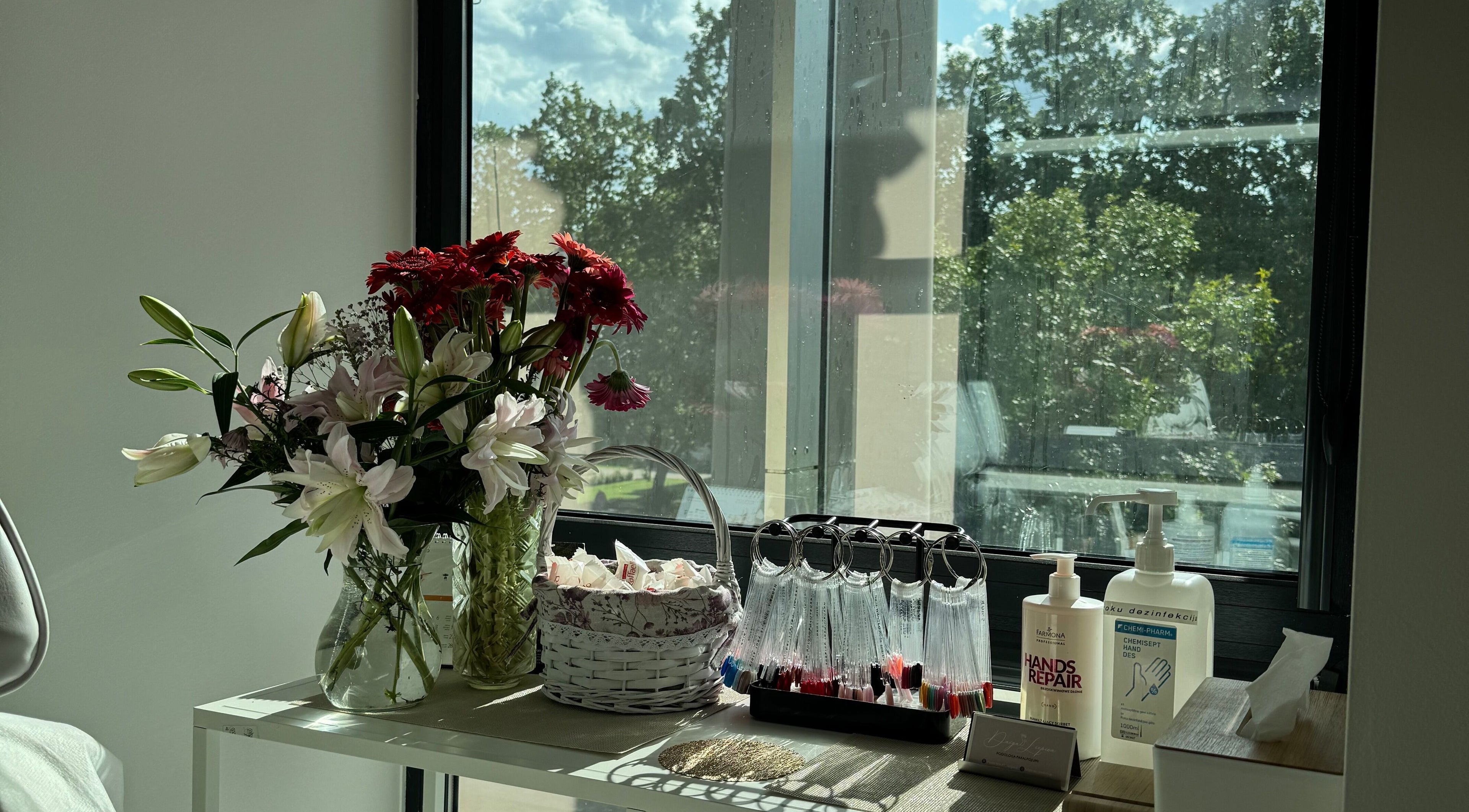 Bright flowers and beauty products by the window at Jelgavas Podologs, Jelgava, LV.