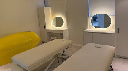 Relaxing treatment room at Esthetia, Taguig, 마닐라 대도시, PH, featuring massage tables and modern decor.