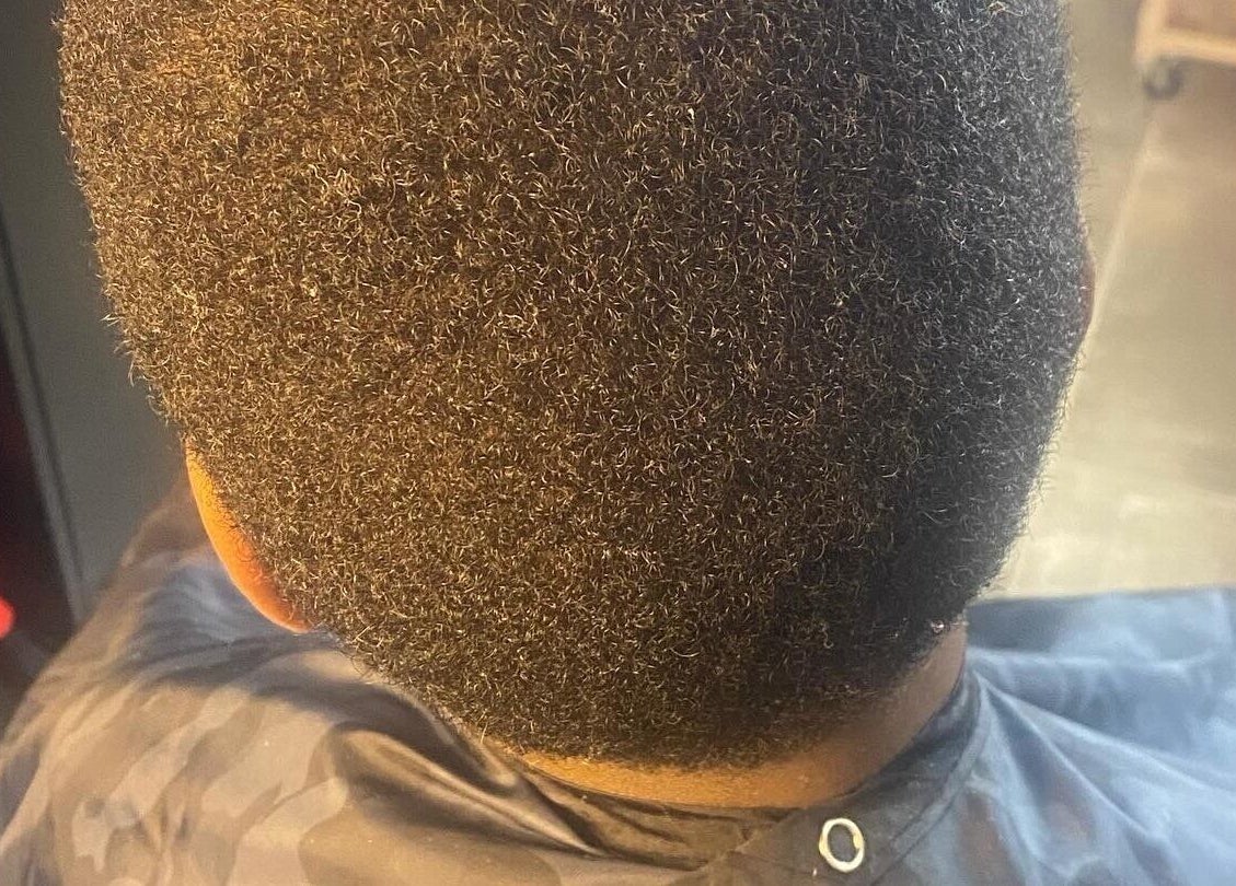 Close-up of a well-groomed hairstyle at Undefined Beauty in Tulsa, Oklahoma, US. Ideal for textured hair styling.