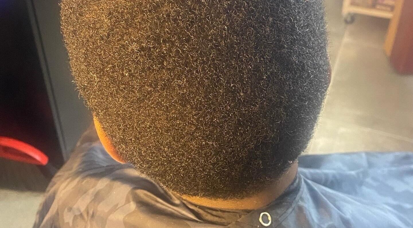 Close-up of a well-groomed hairstyle at Undefined Beauty in Tulsa, Oklahoma, US. Ideal for textured hair styling.