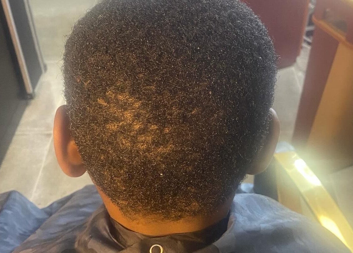 Fresh haircut at Undefined Beauty, Tulsa, Oklahoma, US, showcasing a stylish, textured finish.