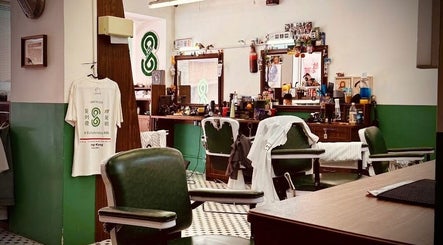 Interior view of 8 To 8 Barbershop HK, 九龍, 九龍, HK with vintage chairs and decor.