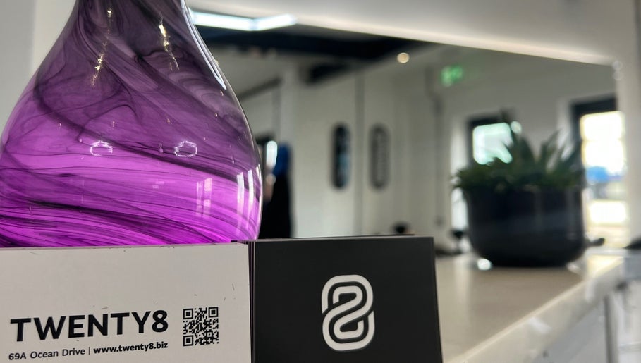 Elegant violet glass decor at Twenty8, Edinburgh, Scotland, GB enhancing the modern salon's tranquil ambiance.