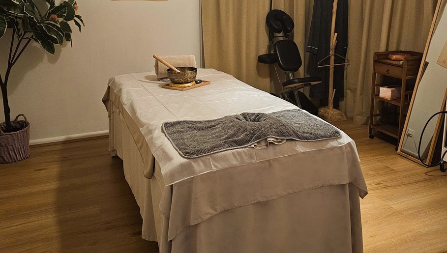 Relaxing massage room at Joro Studio, Melbourne, Victoria, AU, featuring a massage table and soothing decor.