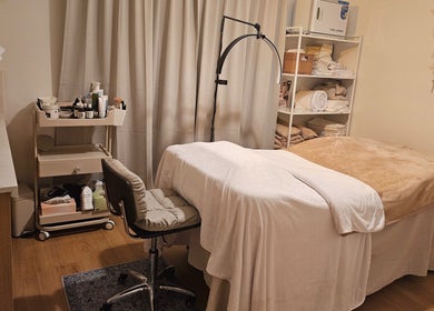 Tranquil treatment room at Joro Studio, Melbourne, Victoria, AU, featuring a cozy massage bed and calming decor.