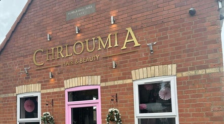 Exterior view of a beauty venue with brick facade and pink accents, representing Jade’s Beauty Room in Messingham, England, GB.