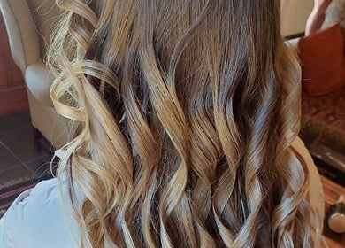 Elegant curls styled at Therapy Hair Studio, Howick, Kwazulu-natal, ZA, showcasing expert hairdressing skills.