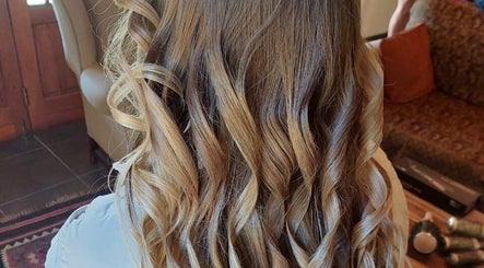 Elegant curls styled at Therapy Hair Studio, Howick, Kwazulu-natal, ZA, showcasing expert hairdressing skills.