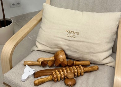 Wooden massage tools on a chair with Bodyrite Contour cushion in El Paraíso, Andalucía, ES.