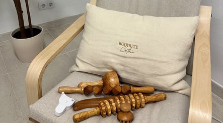 Wooden massage tools on a chair with Bodyrite Contour cushion in El Paraíso, Andalucía, ES.