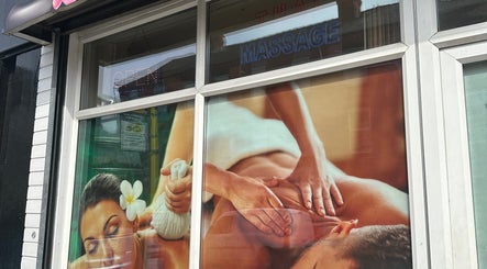 Saehgjan Spa Traditional Thai Massage window display in Liverpool, England, GB offering serene massage scenes.