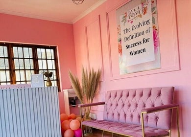 Chic interior of KM Beauty Lounge in Randburg, Gauteng, ZA with elegant pink decor and plush seating.