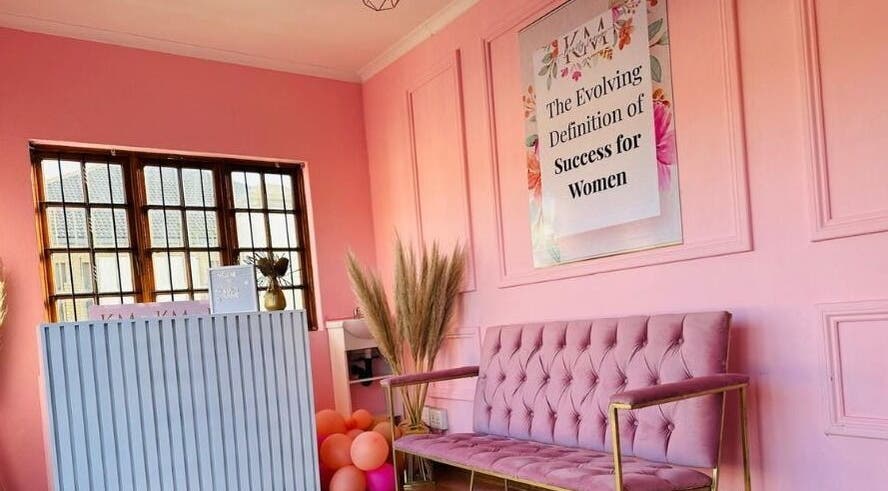 Chic interior of KM Beauty Lounge in Randburg, Gauteng, ZA with elegant pink decor and plush seating.
